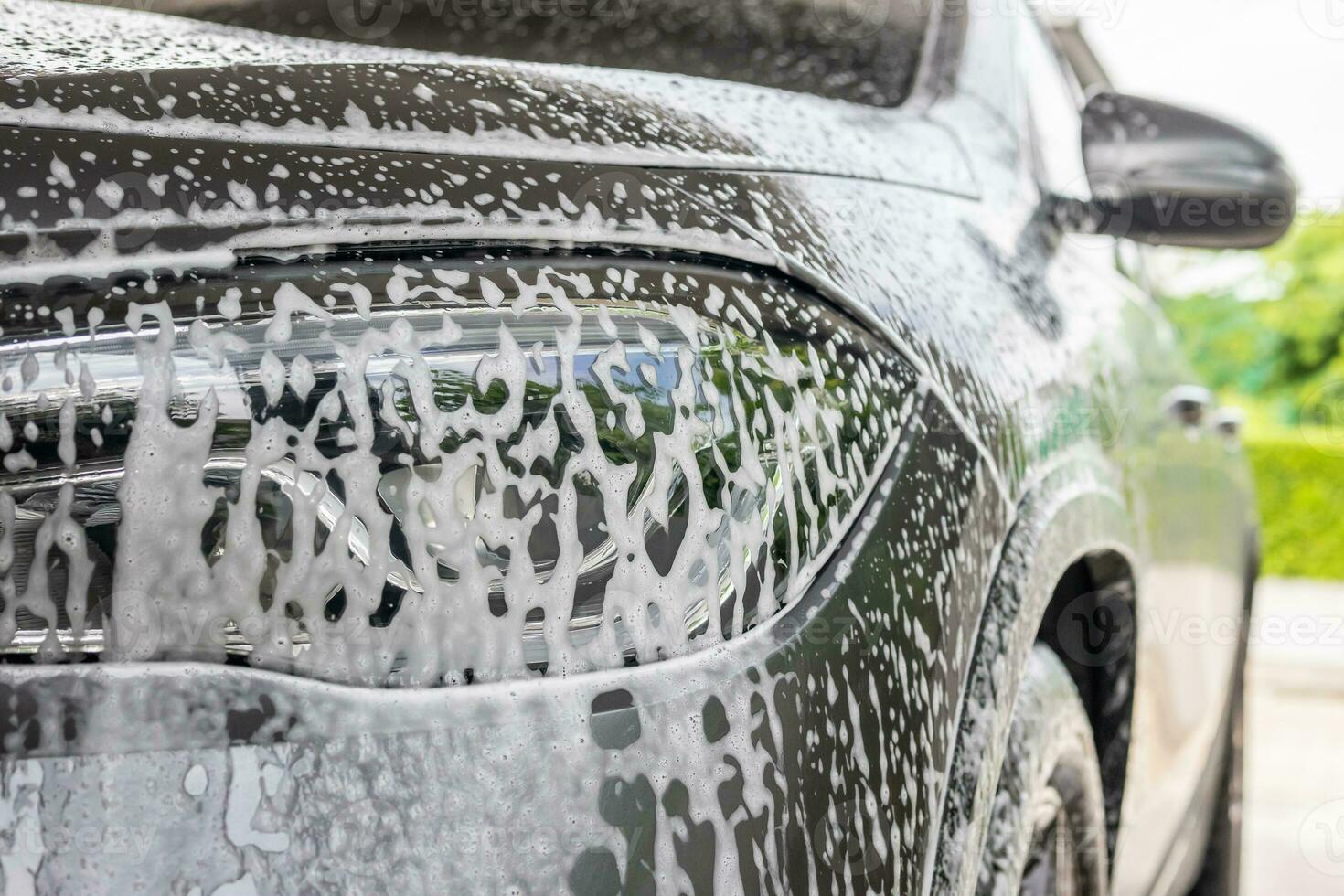 car cleaning and washing with foam soap photo