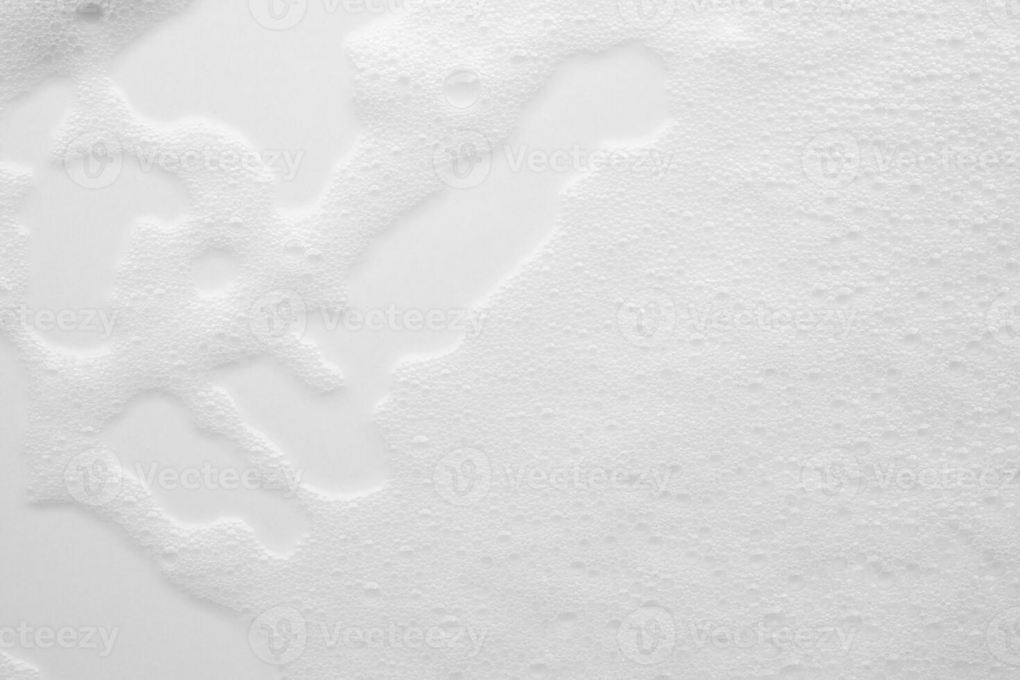 Abstract white soap foam bubbles texture on white background photo