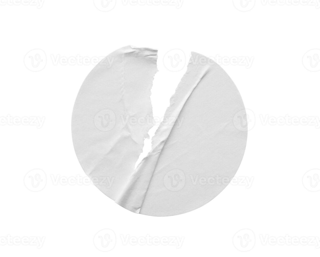 Blank white round torn paper sticker label isolated on white background photo