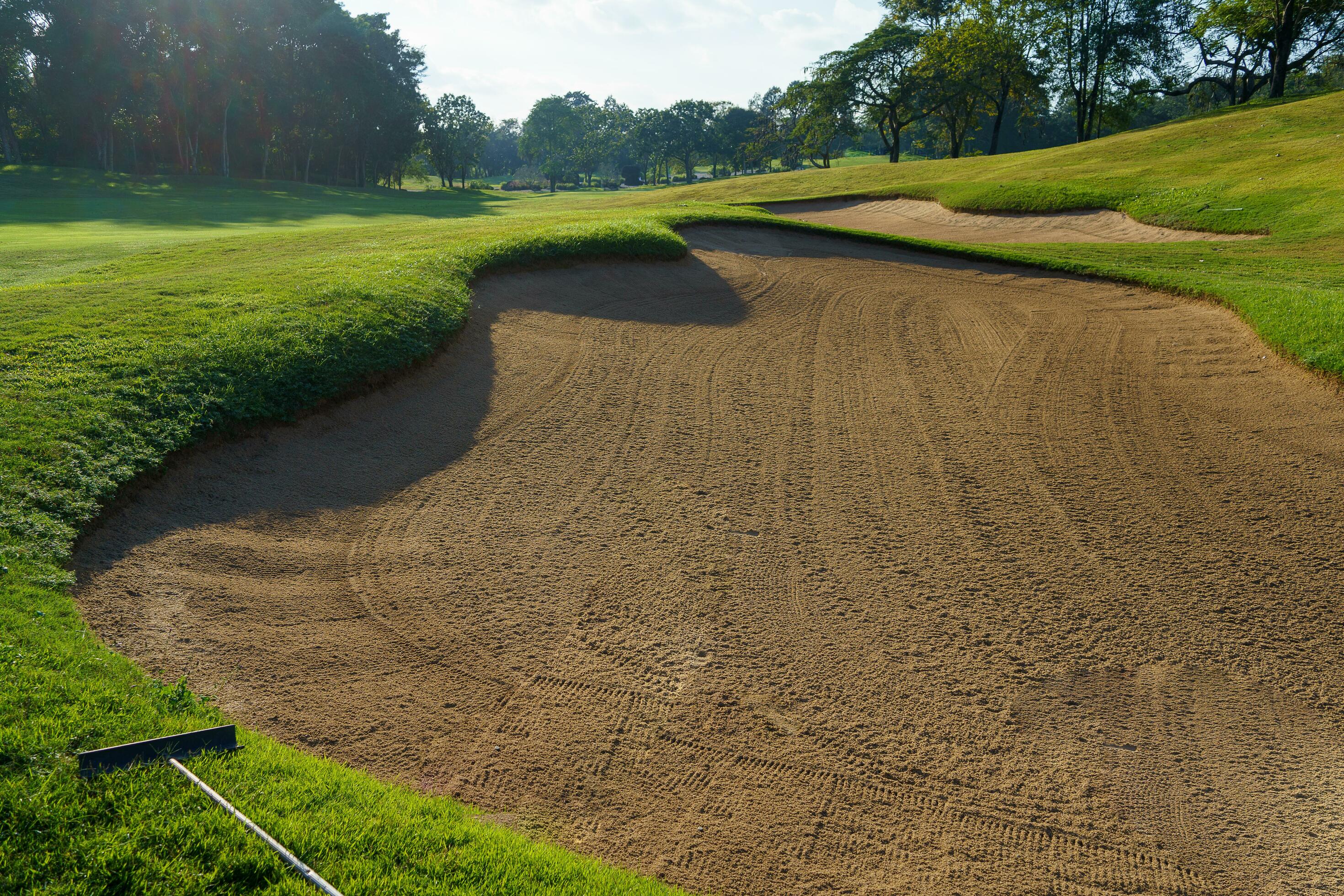 Golf Course Sand Pit Bunkers, green grass surrounding the beautiful