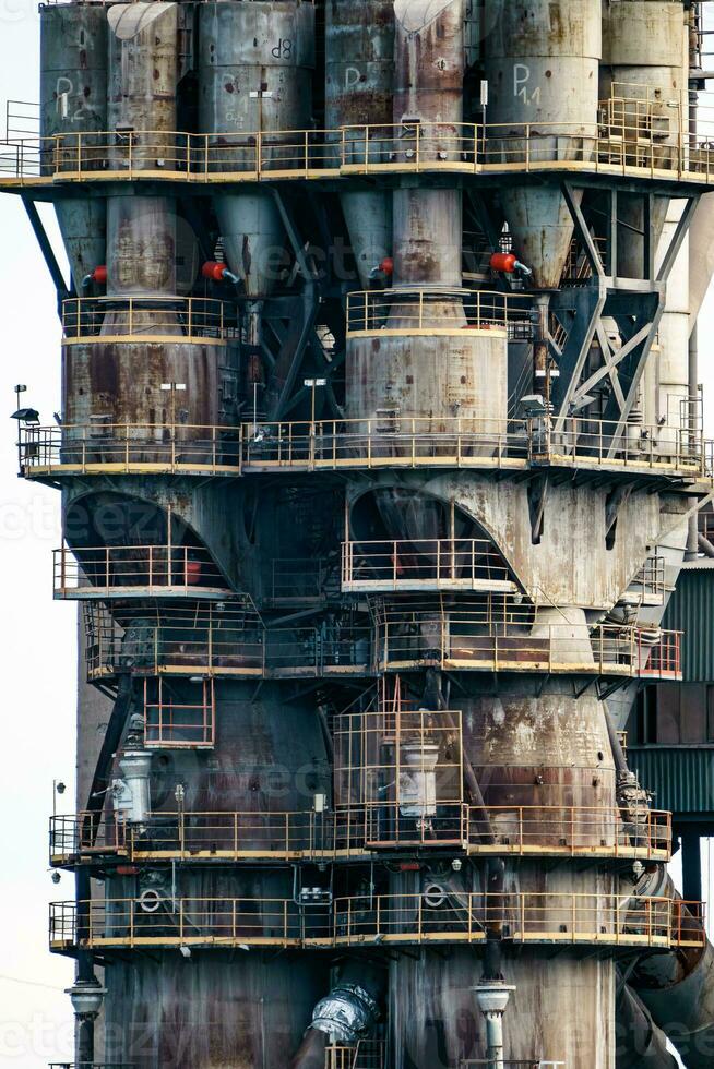 Cement factory, quarry with silos and industrial equipment. Limestone mining for cement production. photo