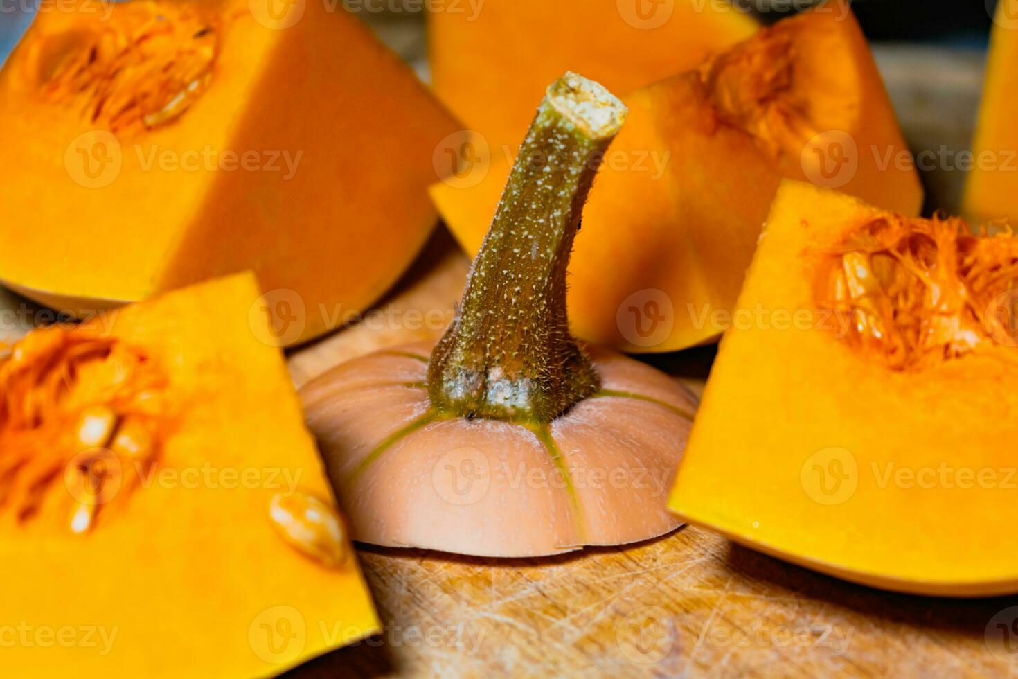 Butternut cut into pieces, squash slices with seeds, cucurbita moschata photo