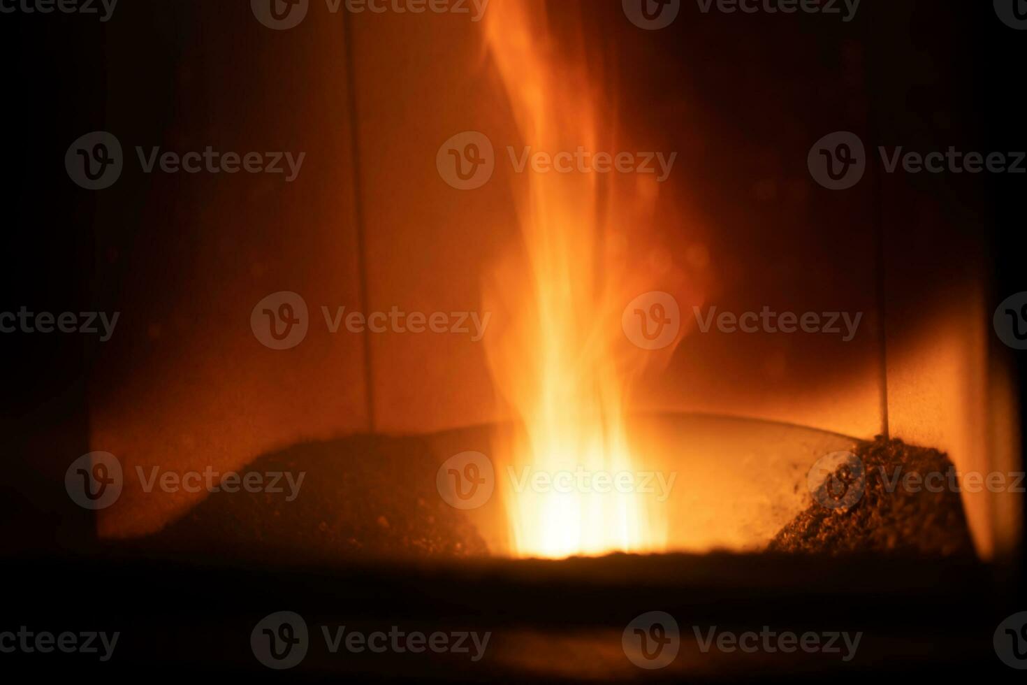 Hearth of a pellet stove, granules stove with flames photo