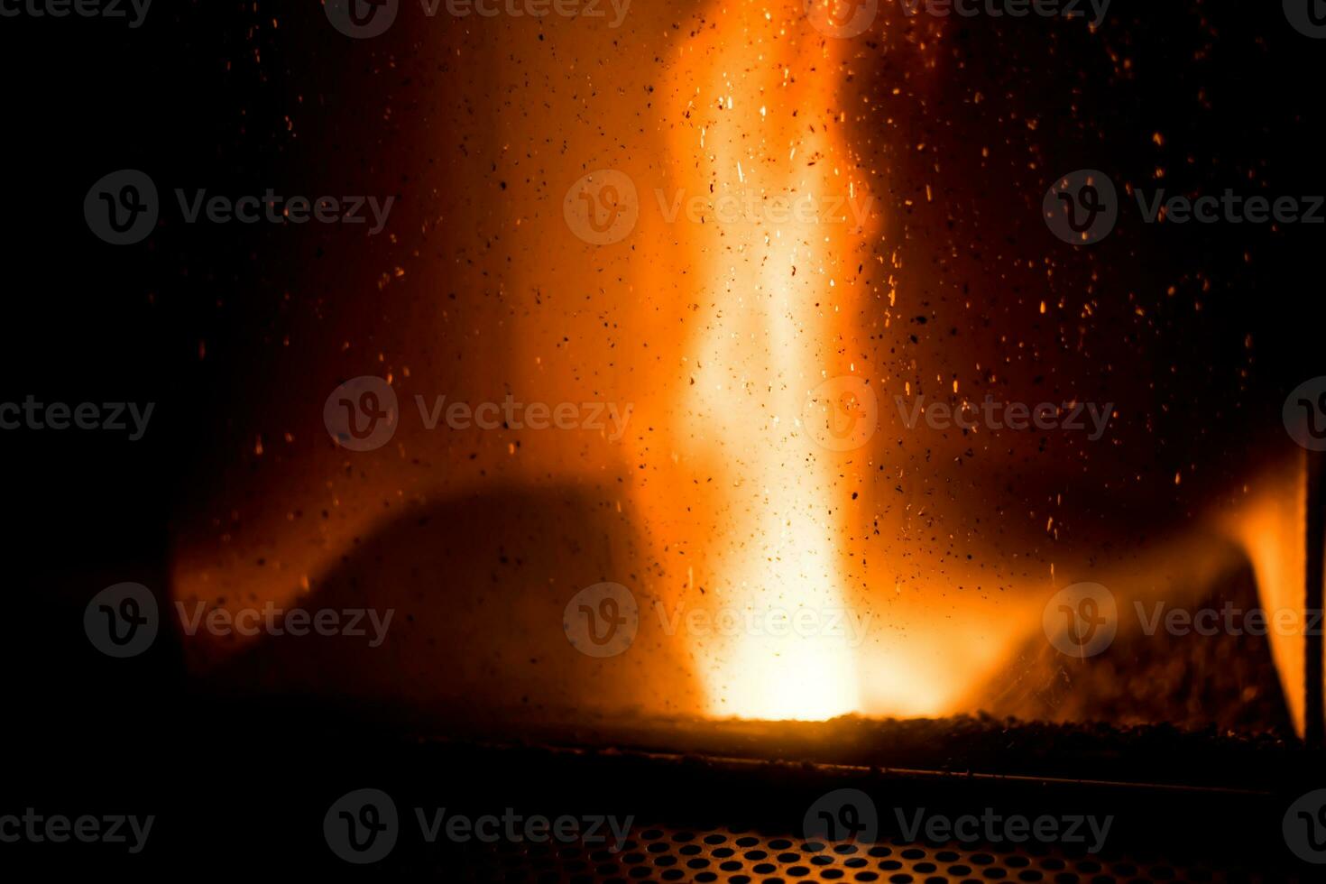 Hearth of a pellet stove, granules stove with flames photo