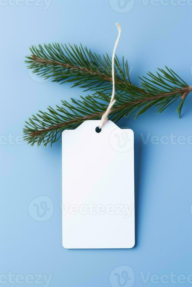 ai generado blanco blanco precio etiqueta en azul antecedentes con Navidad árbol rama. Copiar espacio. foto