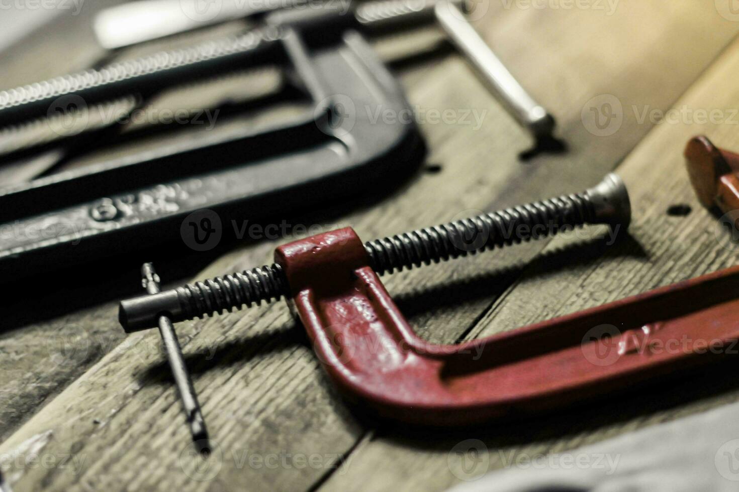 Vintage tone woodworking tool set on wood floor photo