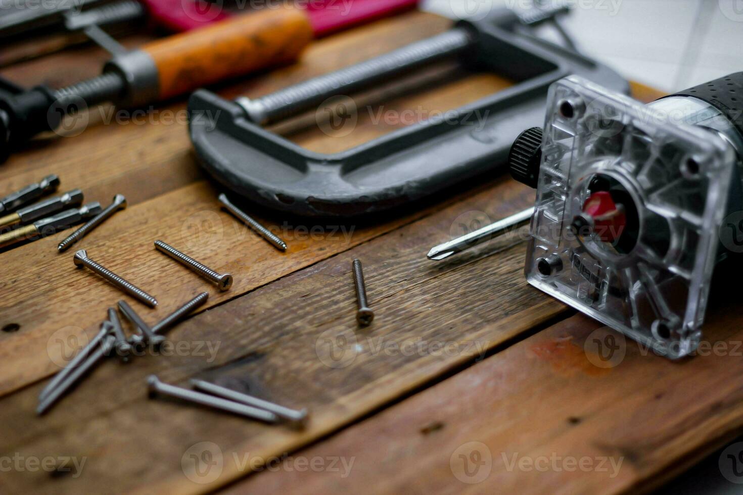 Collection of woodworking tools on a wooden background. photo