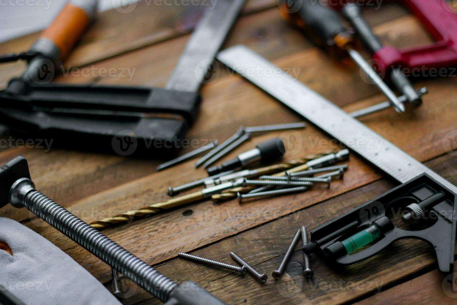 Collection of woodworking tools on a wooden background. photo