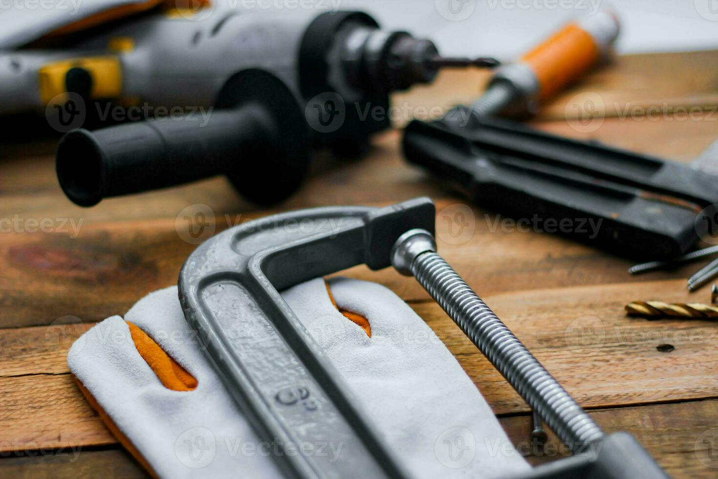 Collection of woodworking tools on a wooden background. photo