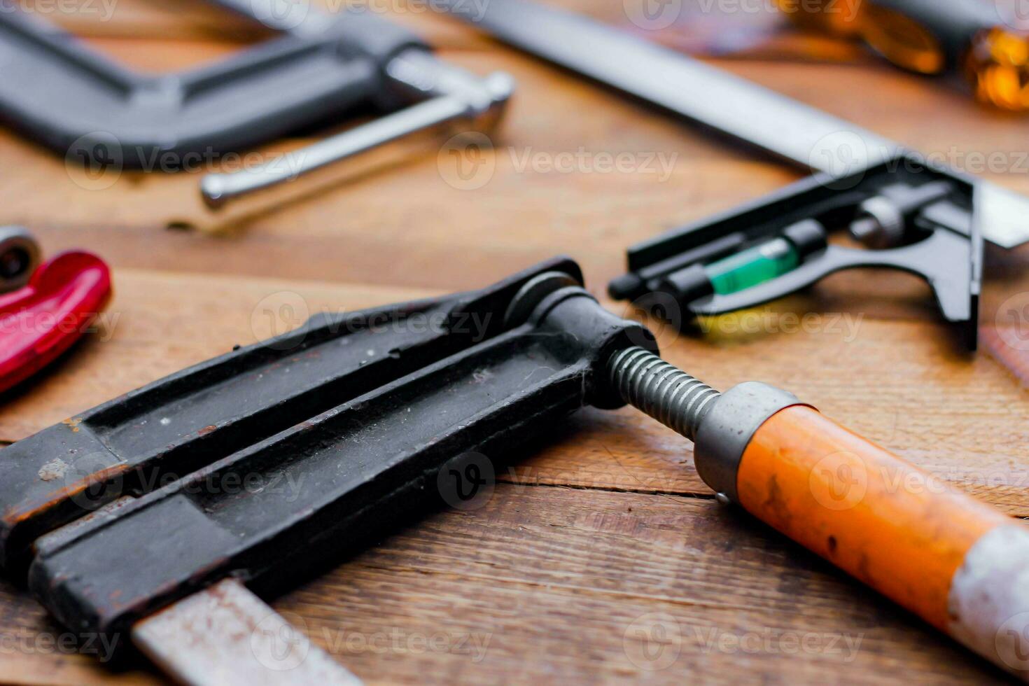 Collection of woodworking tools on a wooden background. photo