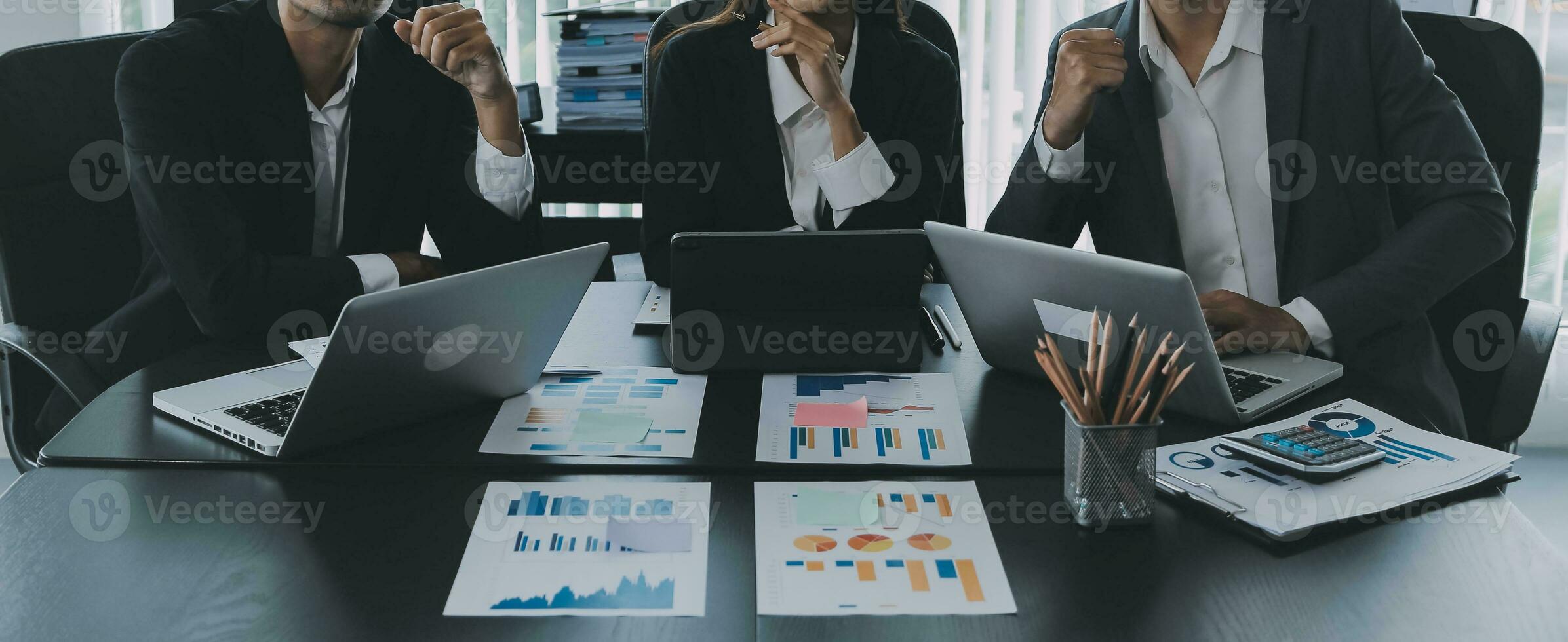 Close up of Business team analyzing income charts and graphs with modern laptop computer. Business analysis and strategy concept. photo