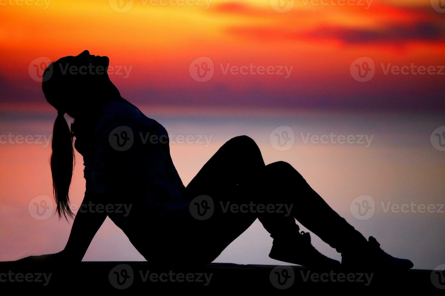 Happy woman relaxing outdoors photo