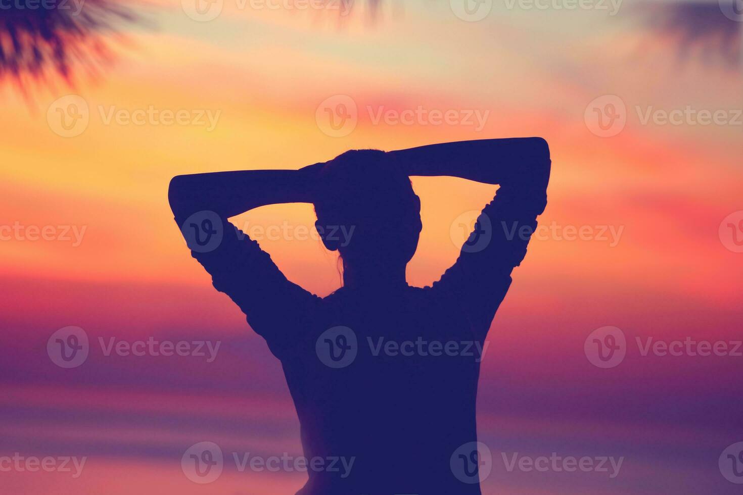Woman relaxing on the beach photo