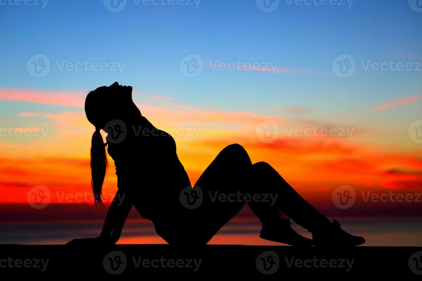 Woman enjoying sunset photo