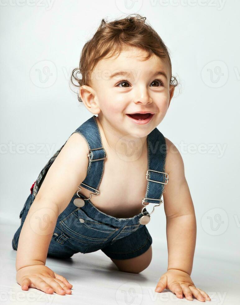 Baby boy crawling in the studio photo