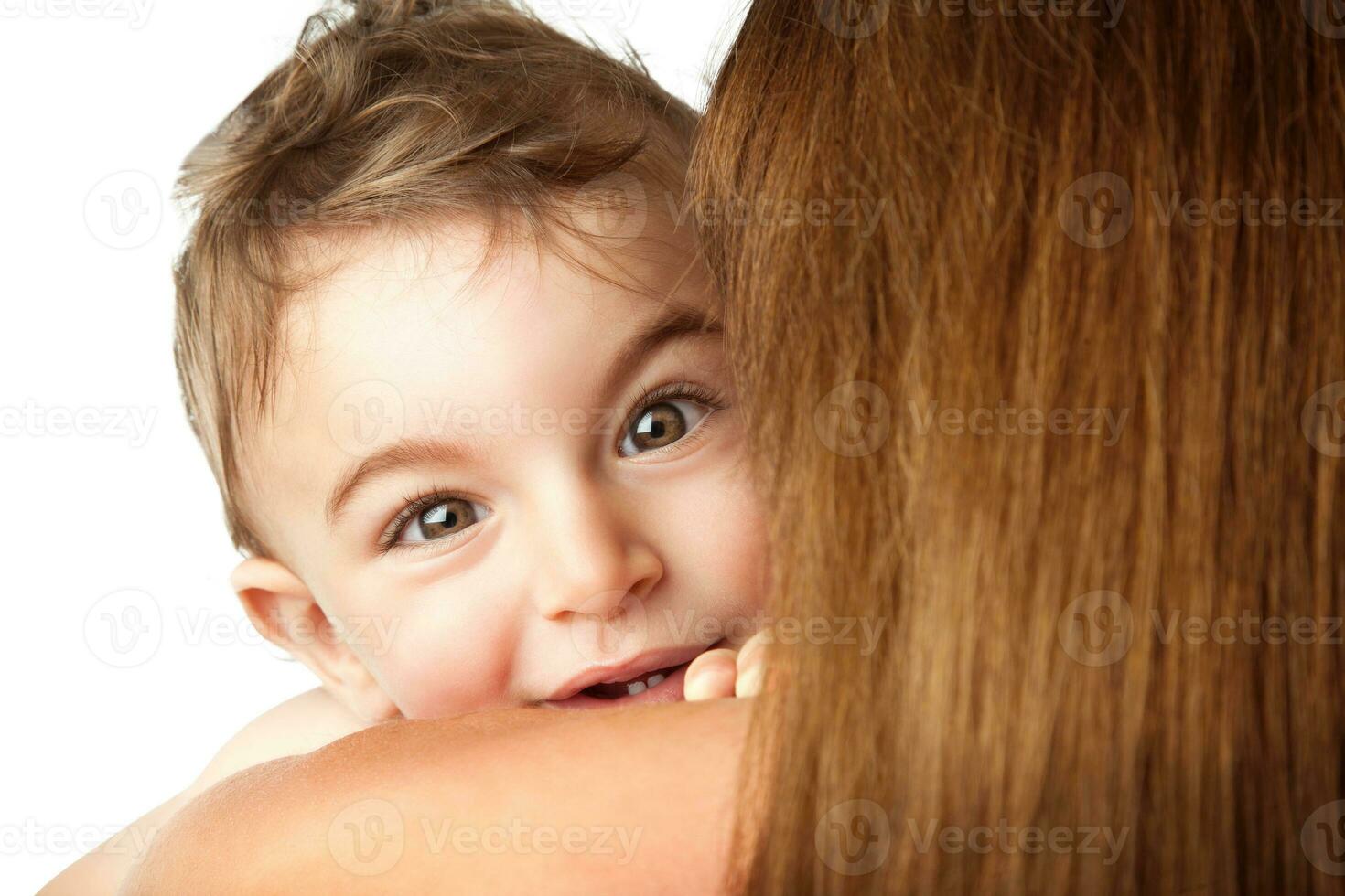 Baby boy playing peek-a-boo photo