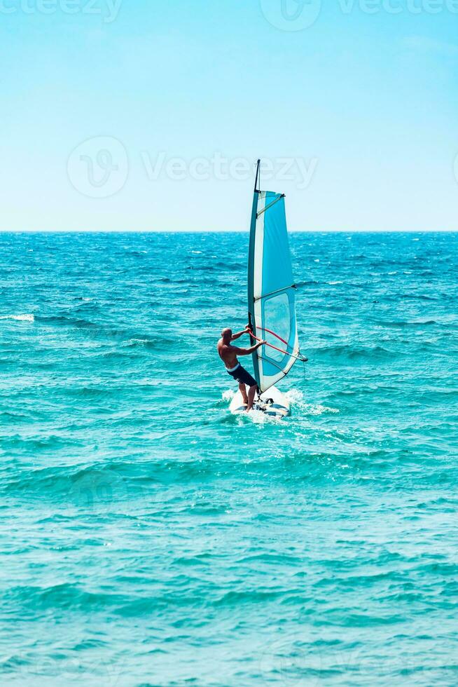 Windsurfer enjoys wind photo