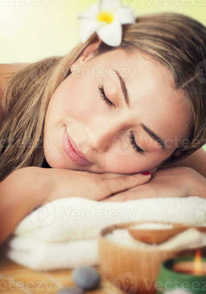 Woman relaxing in the spa salon photo