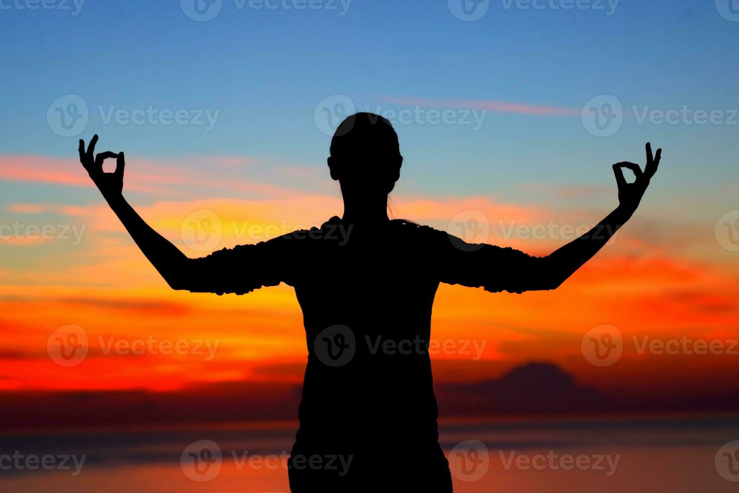 Woman meditating outdoors photo