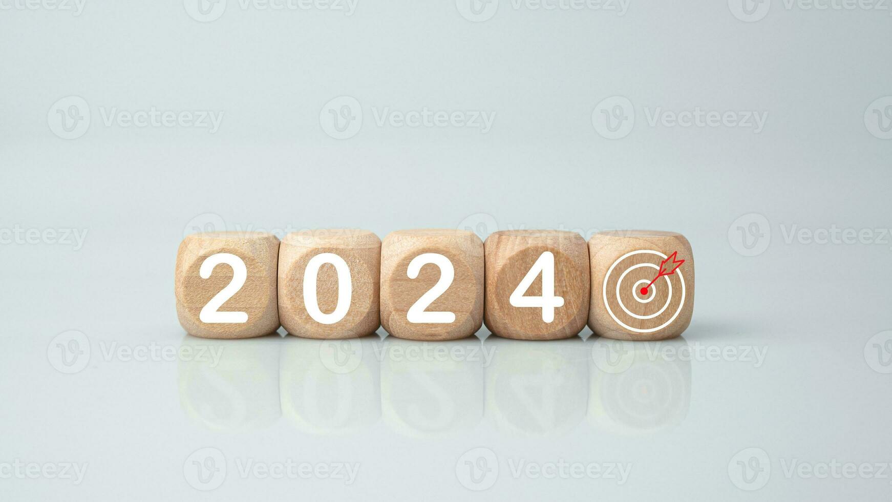 Wooden blocks lined up with the letters 2024. Represents the goal setting for 2024, the concept of a start. financial planning development strategy business goal setting photo