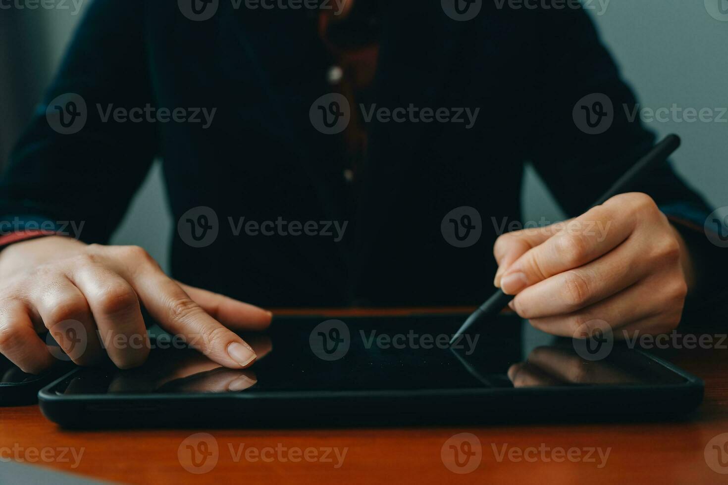 Asian Businesswoman Using laptop computer and working at office with calculator document on desk, doing planning analyzing the financial report, business plan investment, finance analysis concept. photo