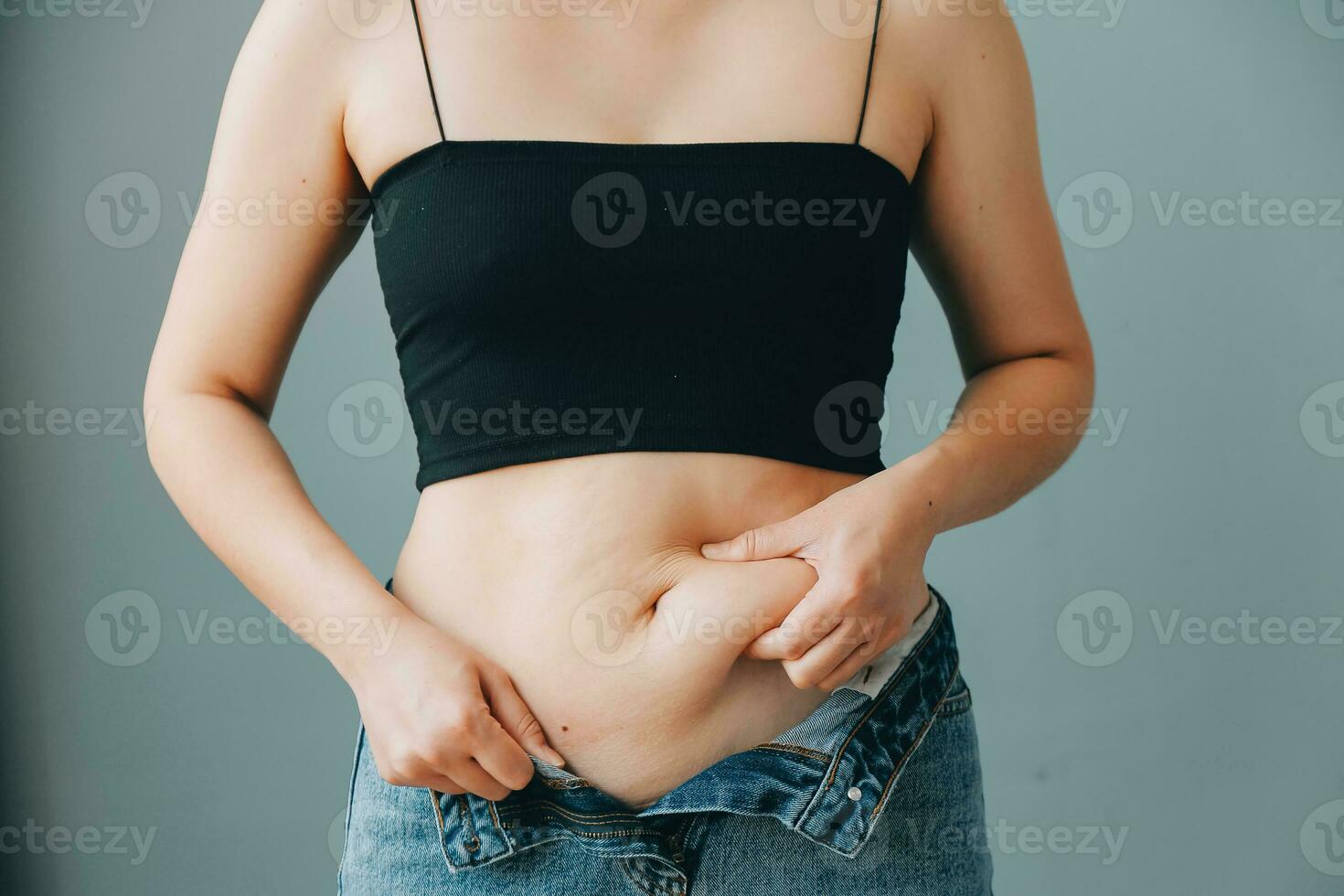 fat woman, fat belly, chubby, obese woman hand holding excessive belly fat with measure tape, woman diet lifestyle concept photo