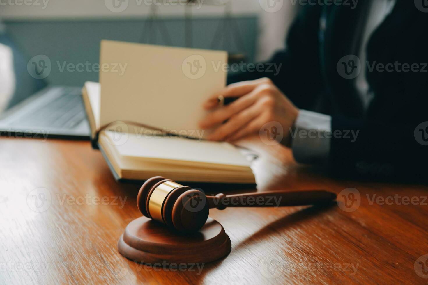 Business and lawyers discussing contract papers with brass scale on desk in office. Law, legal services, advice, justice and law concept picture with film grain effect photo