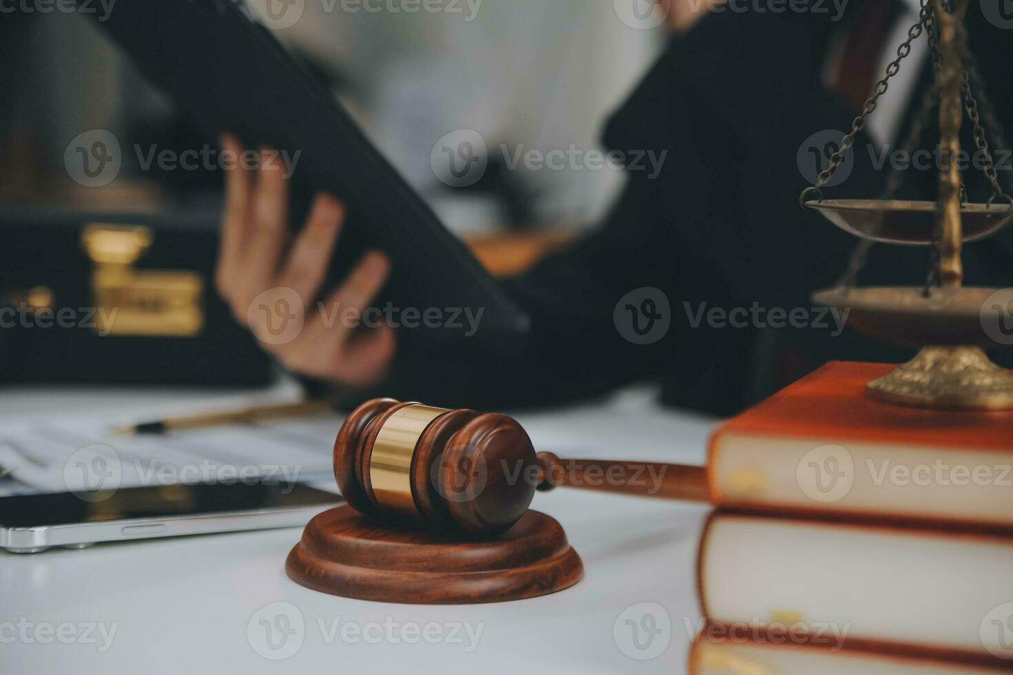 Business and lawyers discussing contract papers with brass scale on desk in office. Law, legal services, advice, justice and law concept picture with film grain effect photo