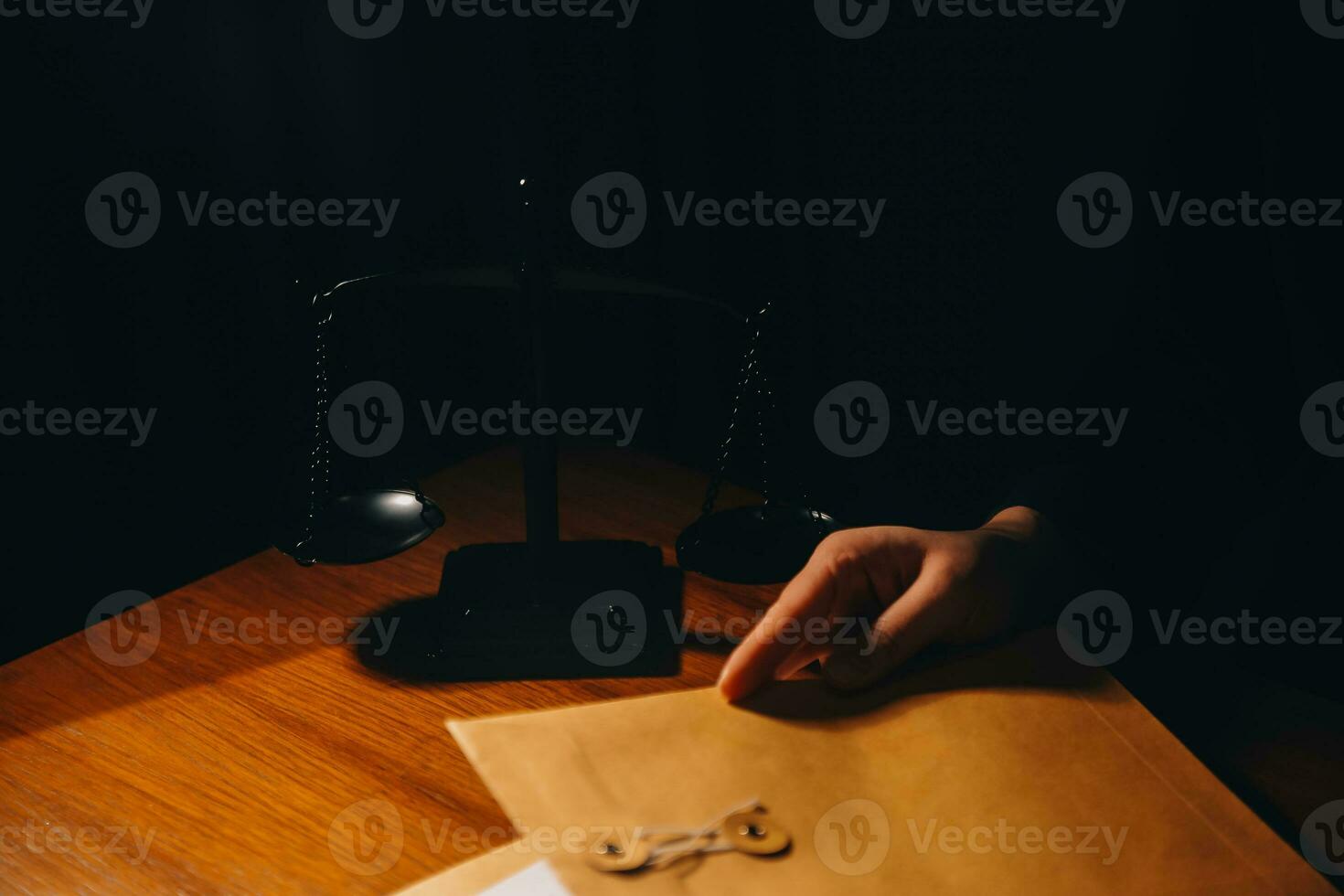 Business and lawyers discussing contract papers with brass scale on desk in office. Law, legal services, advice, justice and law concept picture with film grain effect photo