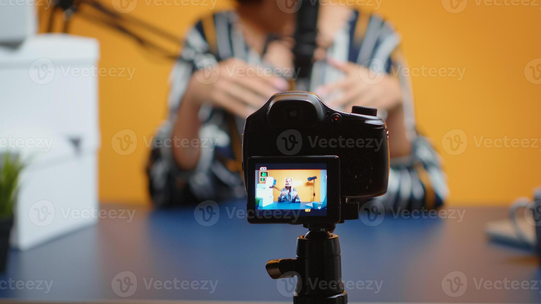 Close up of video blogger recording subscribers present giveaway. Creative content creator social media star influencer expert vlogger recording online internet web podcast gift for audience photo