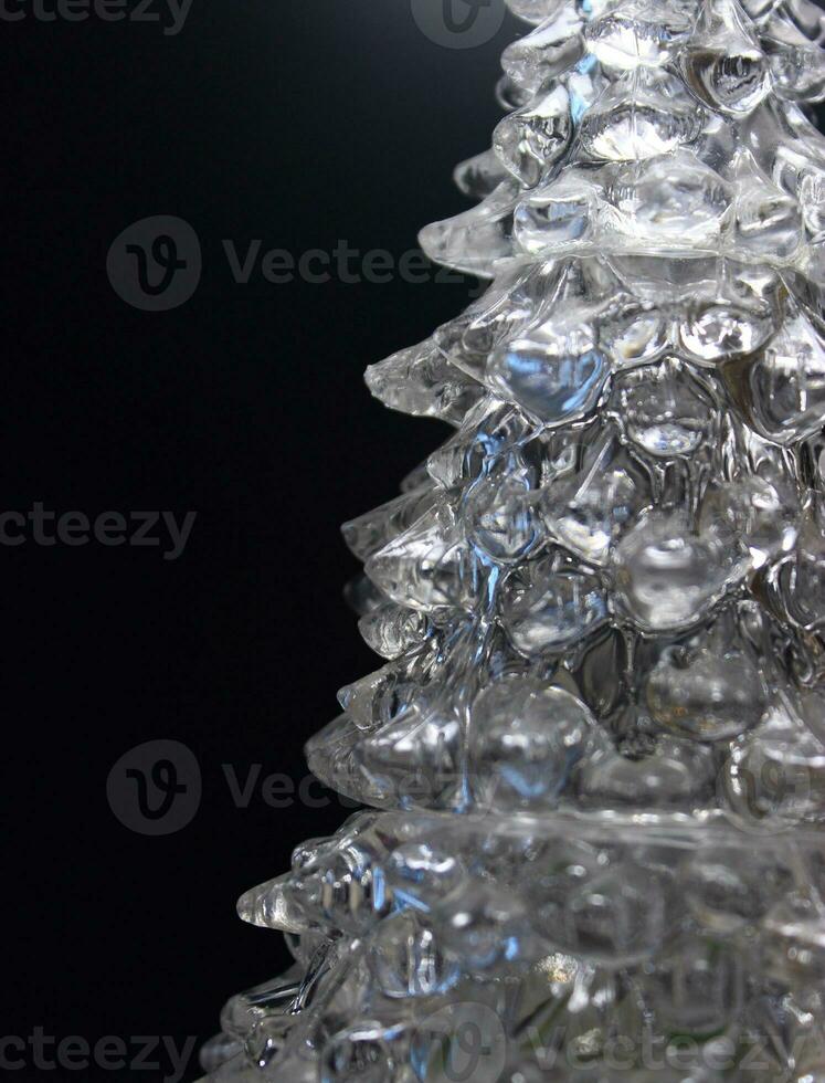 Stepped layering of ice with blue highlights inside isolated on black photo