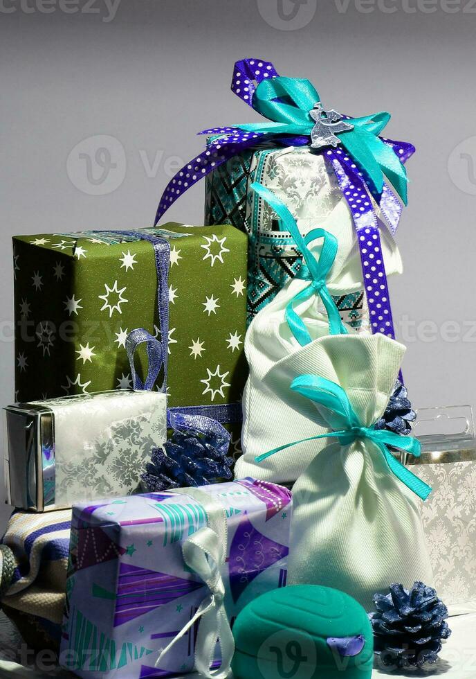 Decoration of Christmas gifts and souvenirs in blue tones stock photo for vertical story