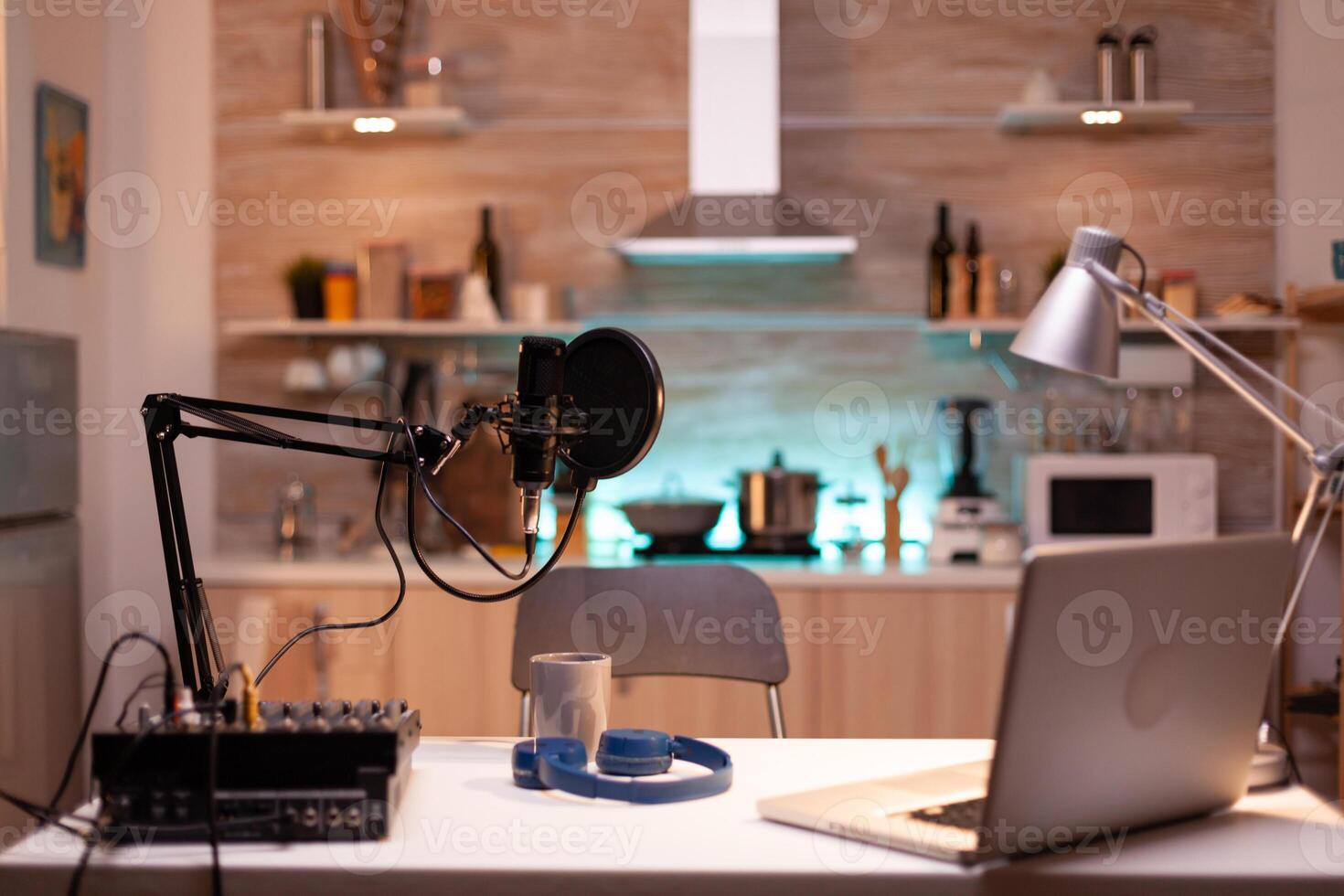 Professional setup for recording podcast in home studio of vlogger. Influencer recording social media content with production microphone. Digital web internet streaming station photo