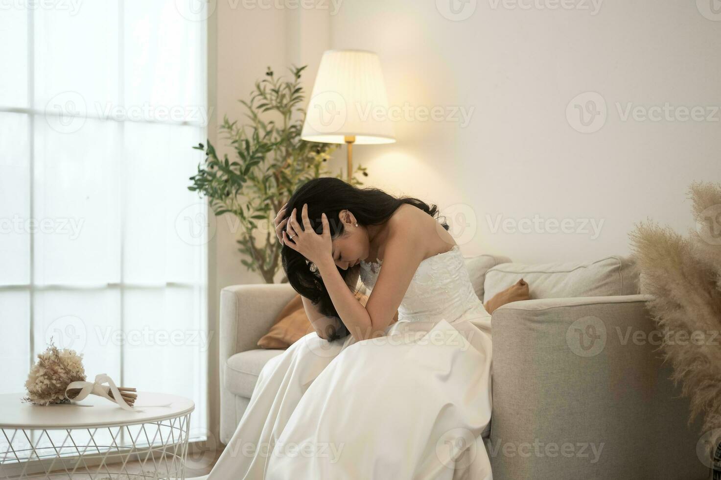 Sad and worried bride crying and arguing with groom in wedding day photo