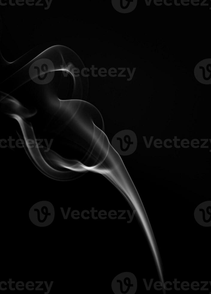 movement of smoke on black background, smoke background, abstract smoke on black background. Aromatic smoke coming out from Dhoop Cone photo