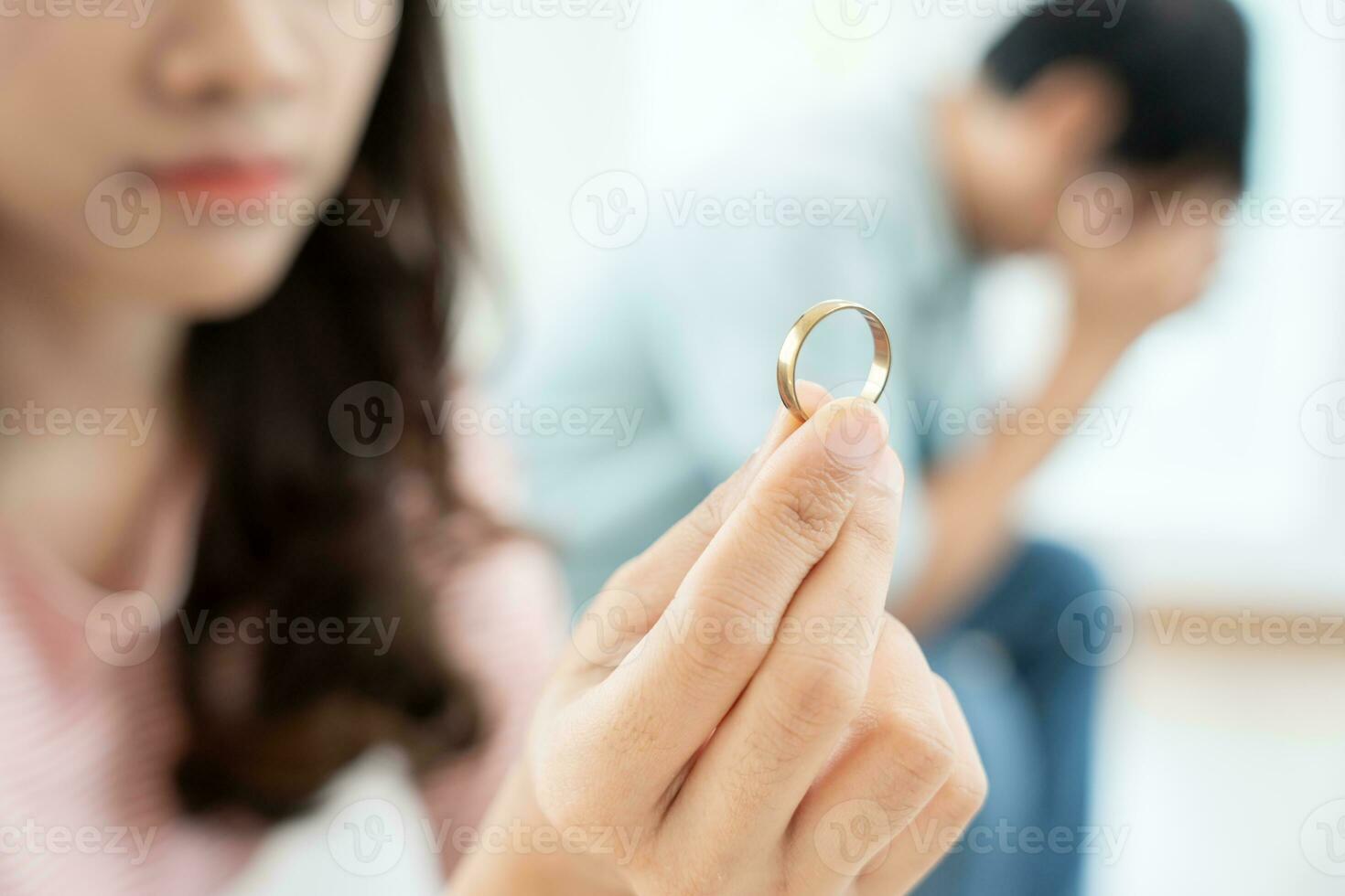 Divorce. Woman remove married ring. Couples desperate and disappointed after marriage. Husband wife sad, upset and frustrated after quarrels conflict. distrust, love problems, betrayals, family, lover photo