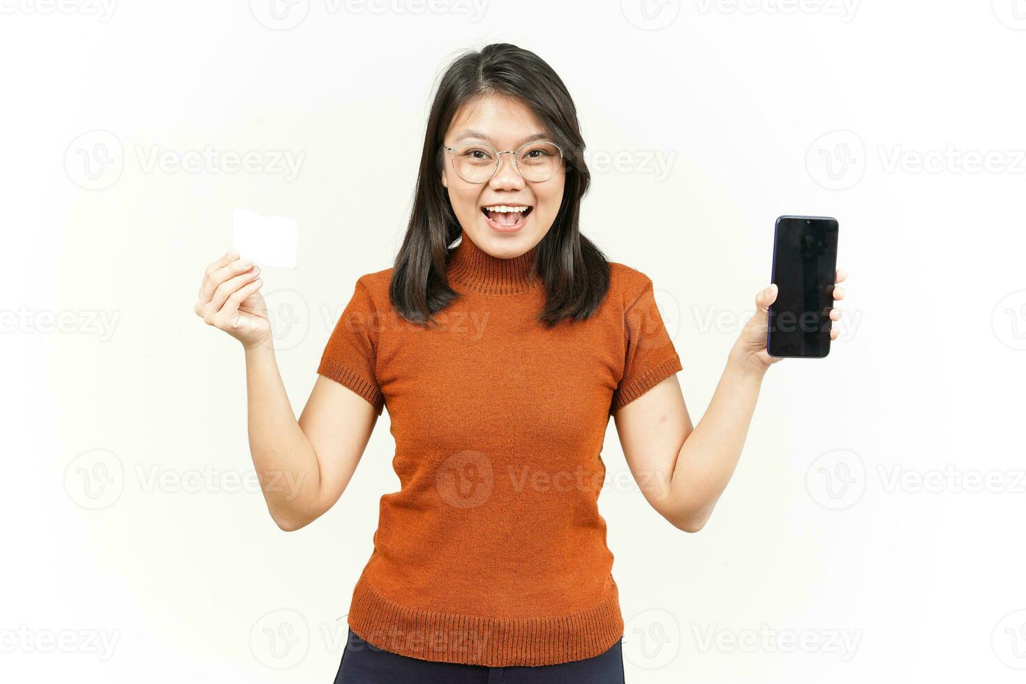 Holding Blank Bank Card and Smartphone With Blank Screen Of Beautiful Asian Woman Isolated On White photo