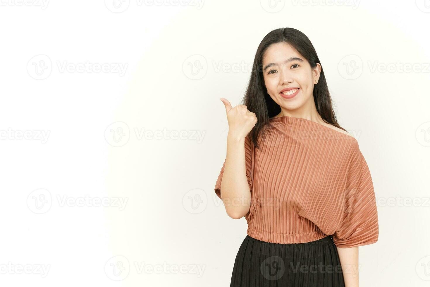Pointing Product on the Side Of Beautiful Asian Woman Isolated On White Background photo