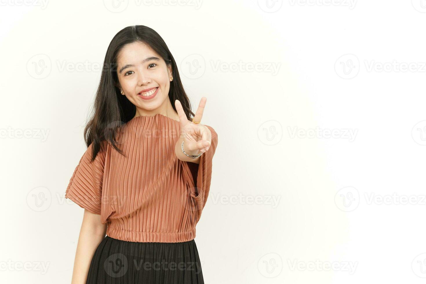 Showing Peace Sign Of Beautiful Asian Woman Isolated On White Background photo