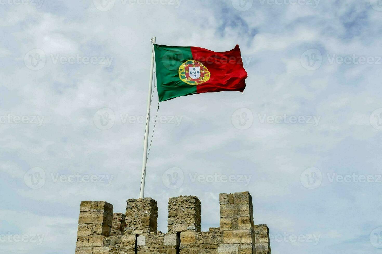 portugal flag on castle tower photo