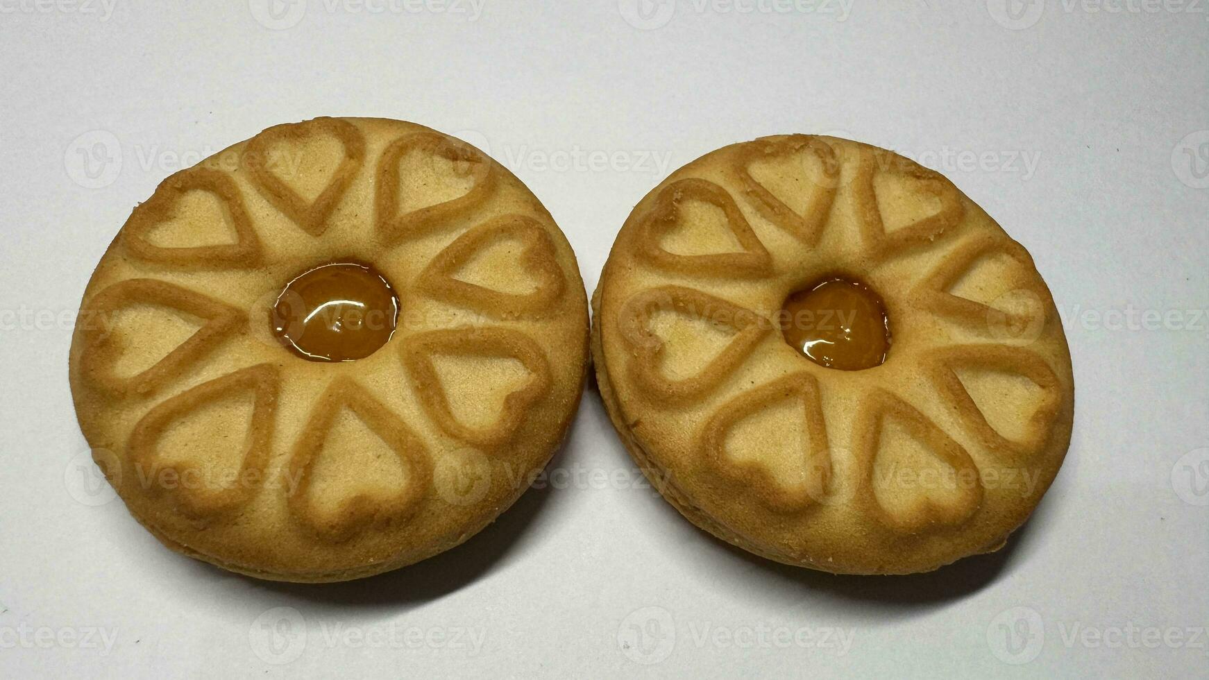 Pineapple jam biscuits, cookie neatly arranged and photographed on a plain white background photo