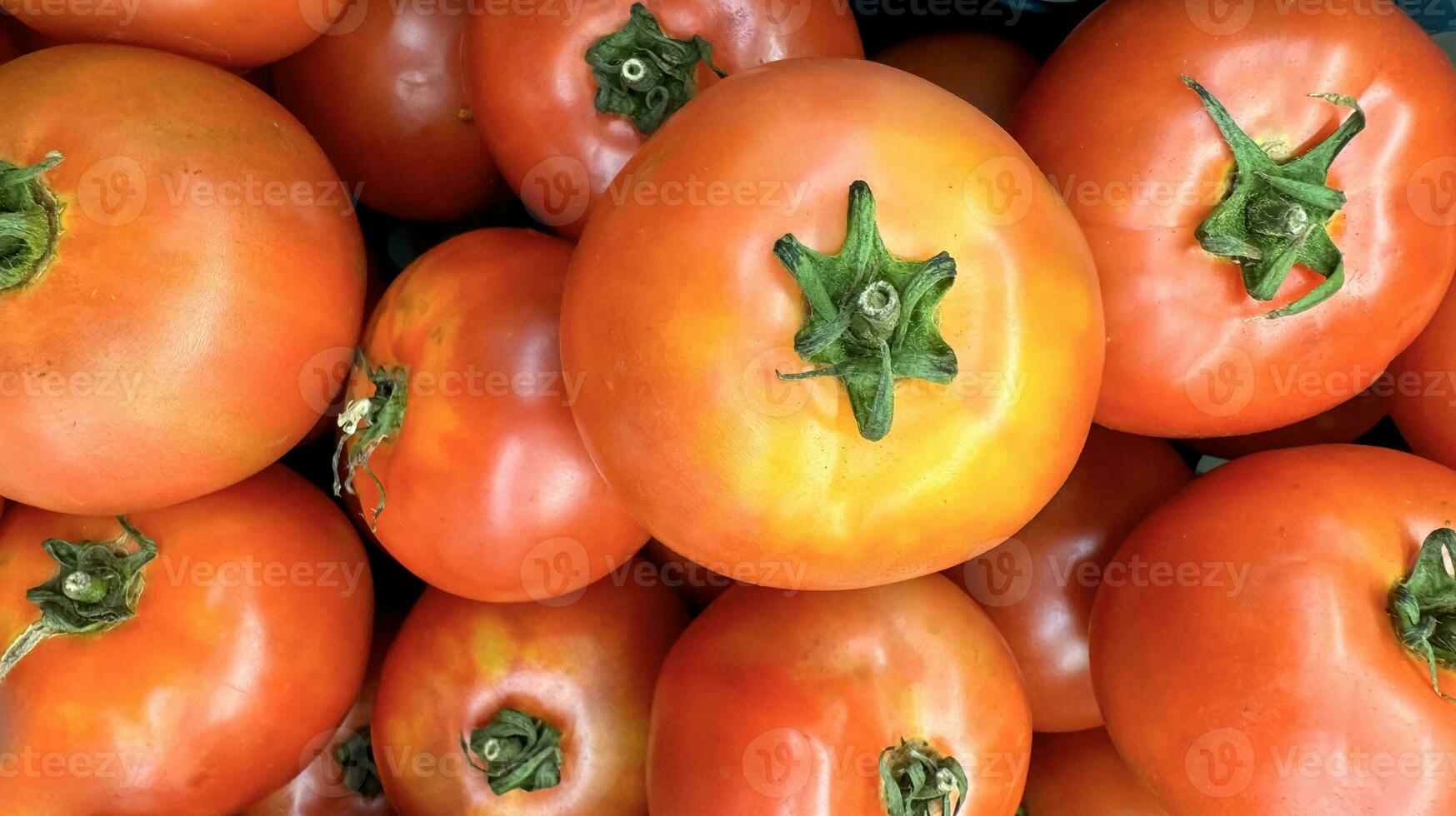 Group of tomatoes lying on a pile on top of each other, tomato texture. Selective focus, for content creation photo