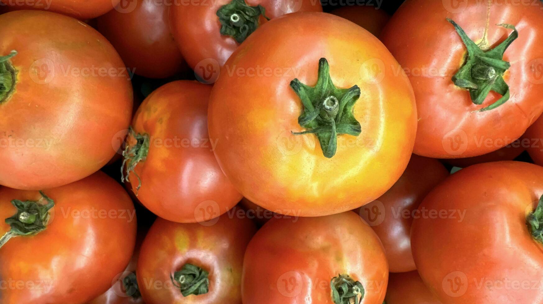 Group of tomatoes lying on a pile on top of each other, tomato texture. Selective focus, for content creation photo