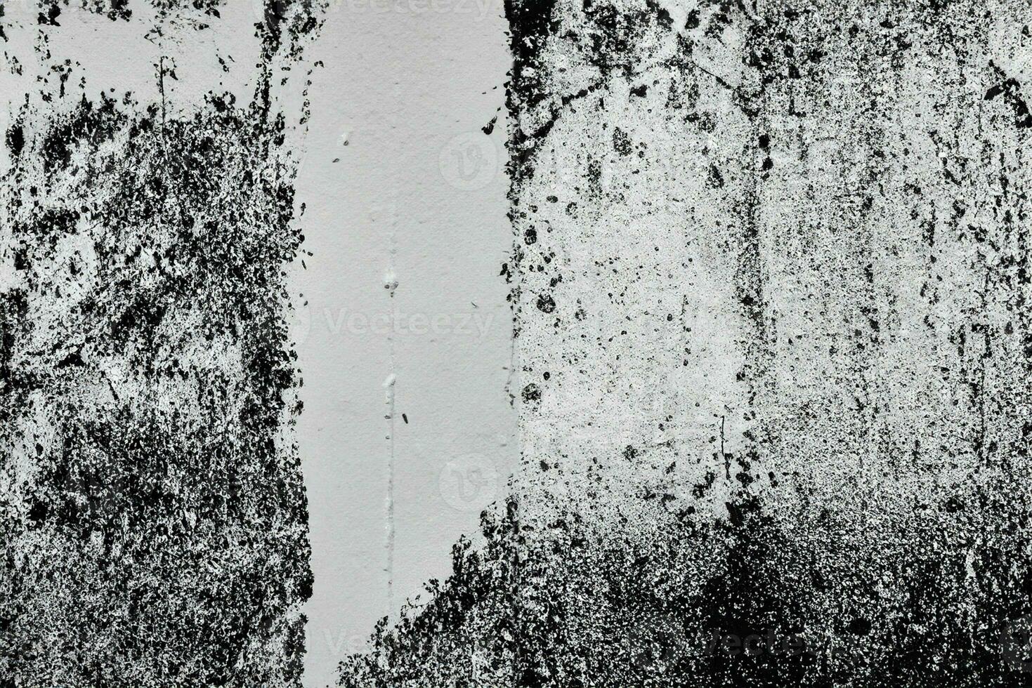 Abstract grunge texture pattern of black paint on white wall photo