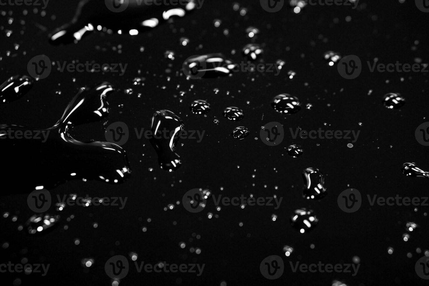 Abstract water spread  with reflection lightning on black background. photo