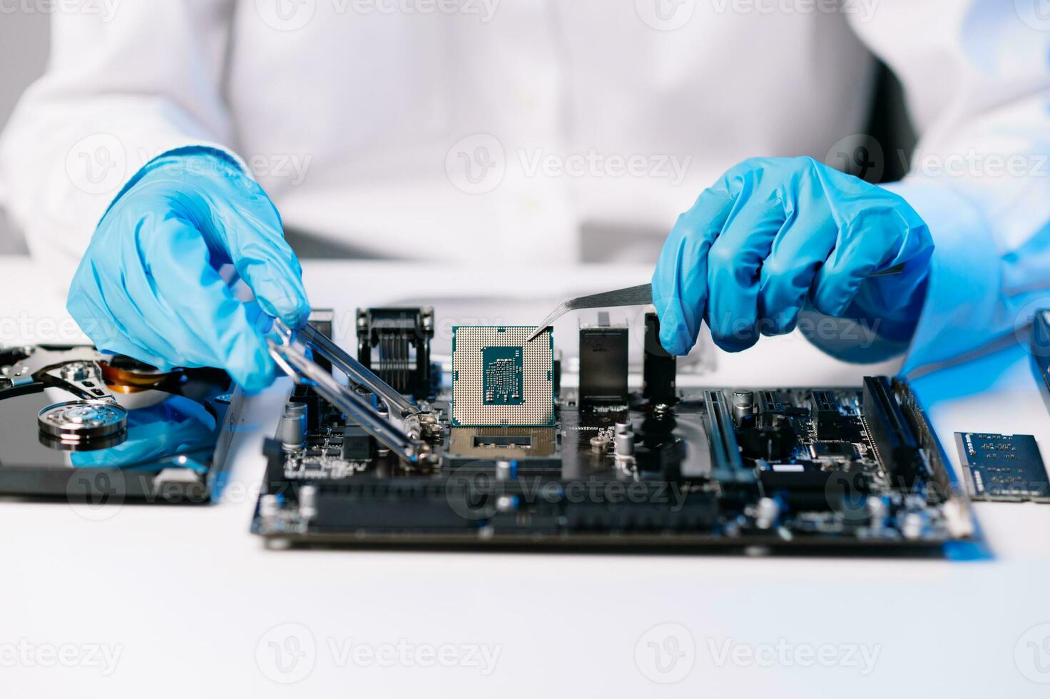 The technician repairing the motherboard in the lab with copy space. the concept of computer hardware, mobile phone, electronic, repairing, upgrade photo