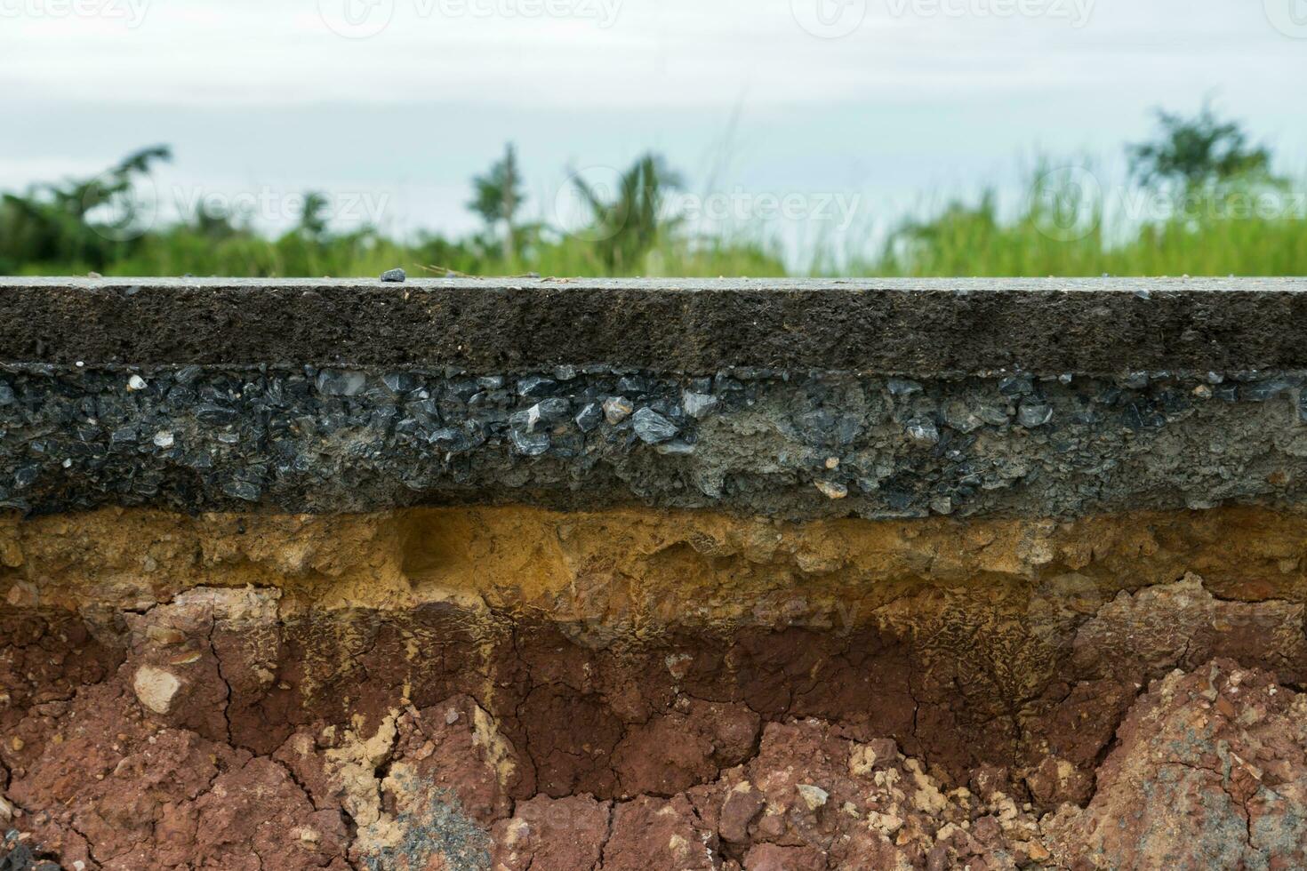 The layer of asphalt road with soil and rock. photo