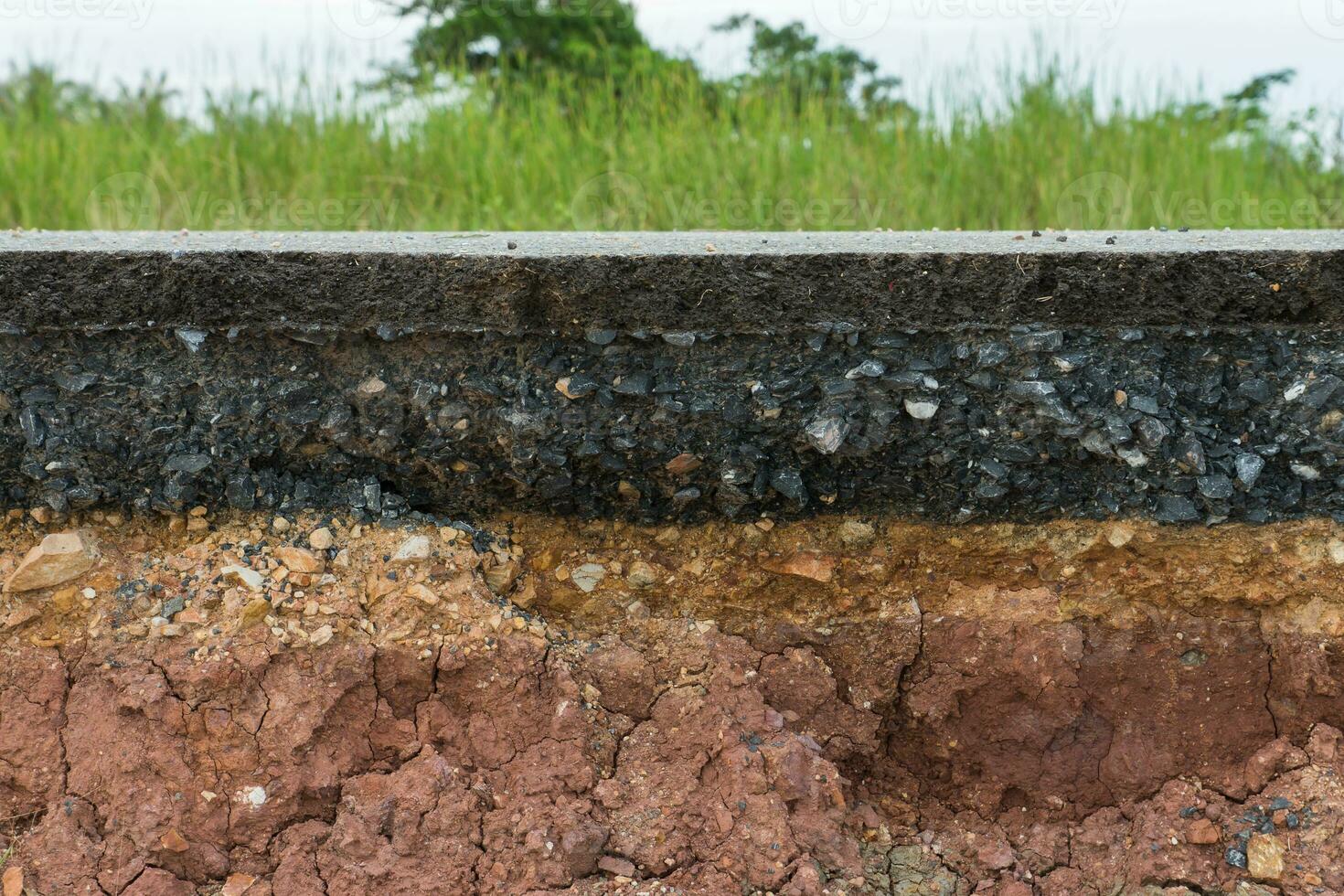 The layer of asphalt road with soil and rock. photo