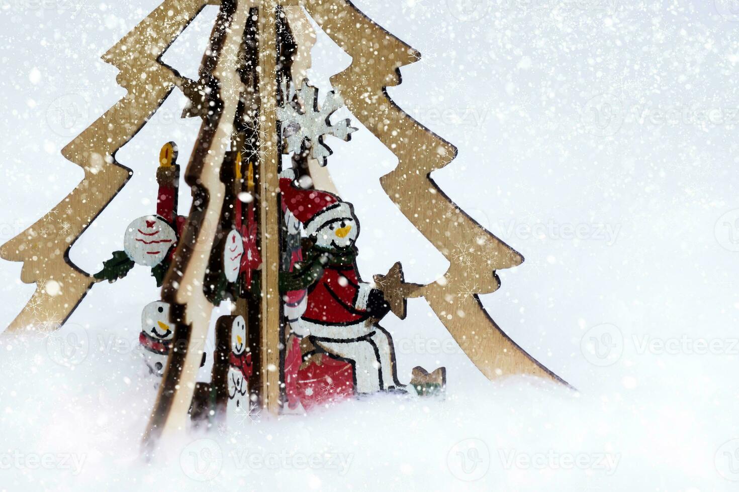 snowman on the Christmas tree and abstract snow fall. Winter holidays concept. photo