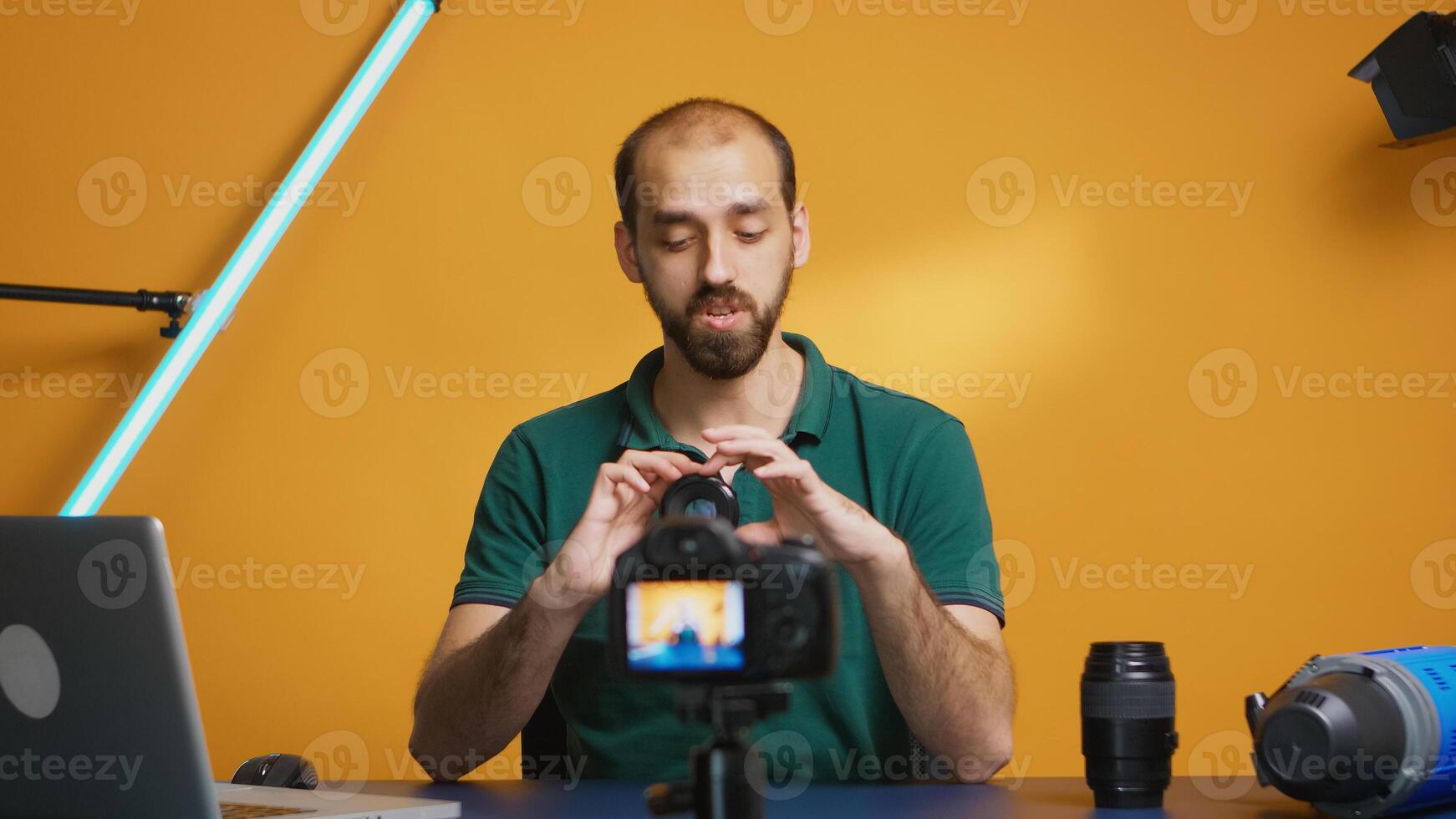 Visual artist recording camera lens comparison for his vlog. Camera lens technology digital recording social media influencer content creator, professional studio for podcast, vlogging and blogging photo